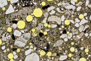  1 Photomicrograph of thin section of M 10, relatively dense microstructure with large air voids 