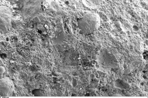  11 SEM micrograph of the fracture face of a thin-bed mortar (sample containing 10 vol.% fumed silica in 50-fold magnification) 