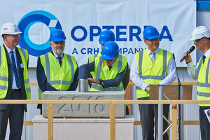  Inserting the traditional “time capsule” at the cornerstone-setting ceremony 
