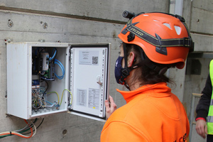  <div class="bildtext_en">1 Ramona Keller, Head of Maintenance at Jura-Cement-Fabriken AG, checking the IoT box which sends the collected data via a mobile connection to the Premas<sup>®</sup> Cloud</div> 