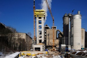  09.03.2010: The tower continues to grow and the cooler and kiln hood are installed  