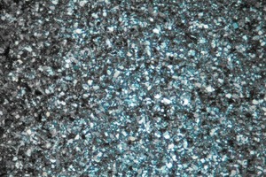  16	Medium-grained greywacke, light grey and white grains (clastic quartz) in the fine quartz matrix, Pol. × 