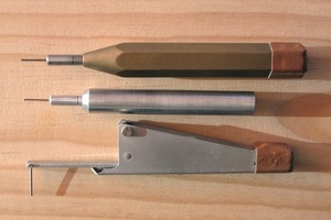  2	Instruments for testing the stiffening and setting with spring ­powers of 0.1, 1 and 300 N (from bottom to top) and with the standardized Vicat needles 