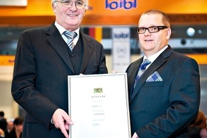  President of the District Court Regensburg Guenther Ruckdaeschel handing over the certificate to Arthur Loibl (right) 