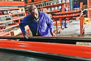  1 A worker inspects a freshly molded belt cleaner blade at the Martin Engineering facility in South Africa 