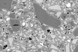  	SEM-BSE, M2-Anschliff Alter 92d: (A: Hohlraum mit C4AF-Klinkerrest, B: Quarzpulver, C: Hohlraum („hollow shell“), D: HÜS-Korn) 