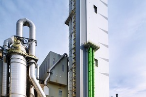  2	New, 108 m high preheater tower in Wössingen; the conditioning tower is on the left  