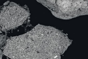  1 a and b SEM (­Scanning Electronic Microscope) images of a typical additive consisting of encapsulated antimony compound. 1 a shows a 130 times magnification: particles dimension is around 500 µm. 1 b shows a much higher magnification (4000 times) 