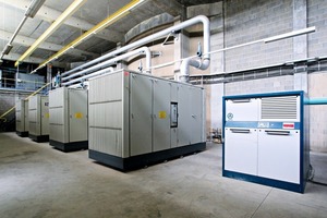 3 Four large screw compressors and four rotary blowers are working in a hall as a central air system
