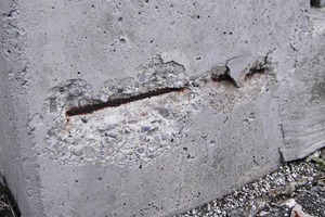 Damage due to corrosion of concrete in a building component