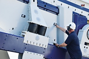 3 Haver systems specialist taking a ­measurement