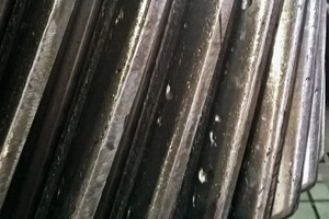 2 Pitting damage to the tooth flank of a double helical pinion shaft