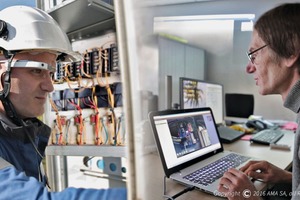 Using Xpert Eye, an engineer supports an on-site technician working on a switch box