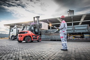 The finished pallets are loaded onto the truck beds