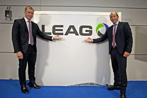 Jan Springl, EPH Director, and Dr. Helmar ­Rendez, CEO at LEAG, present the new logo