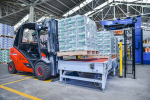 9 Picking up the palletised and packaged products with a fork-lift truck and delivering them to the outgoing goods