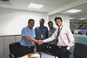 N.K. Priyani, Head Procurement FLS India, and his team shaking hands with Raju Gupta, Managing Director Aumund India