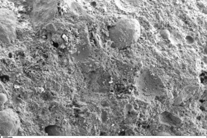 11 SEM micrograph of the fracture face of a thin-bed mortar (sample containing 10 vol.% fumed silica in 50-fold magnification)