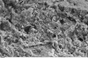 14 SEM micrograph of the fracture face of a thin-bed mortar sample containing 10 vol.% silica, in 1000-fold magnification