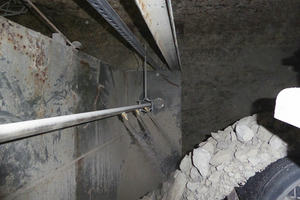 The dust management system treats the material from the top and bottom during discharge