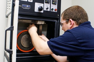 2 A dry abrasion tester checks three-body abrasive wear, such as between a conveyor belt, chute liner and bulk material