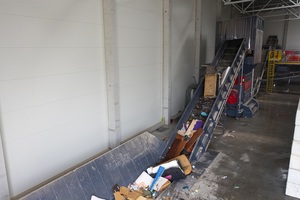 The material is delivered for pre-shredding