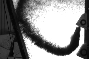4 Example for discharge trajectories of the material, while the buckets for alternative fuels with different transport speeds and materials