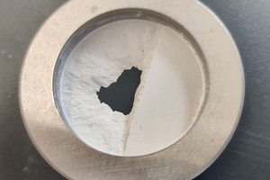 4 Lower surface of a pressed tablet first broken by lamination after incomplete de-aeration during pressing and eroded by compressed air